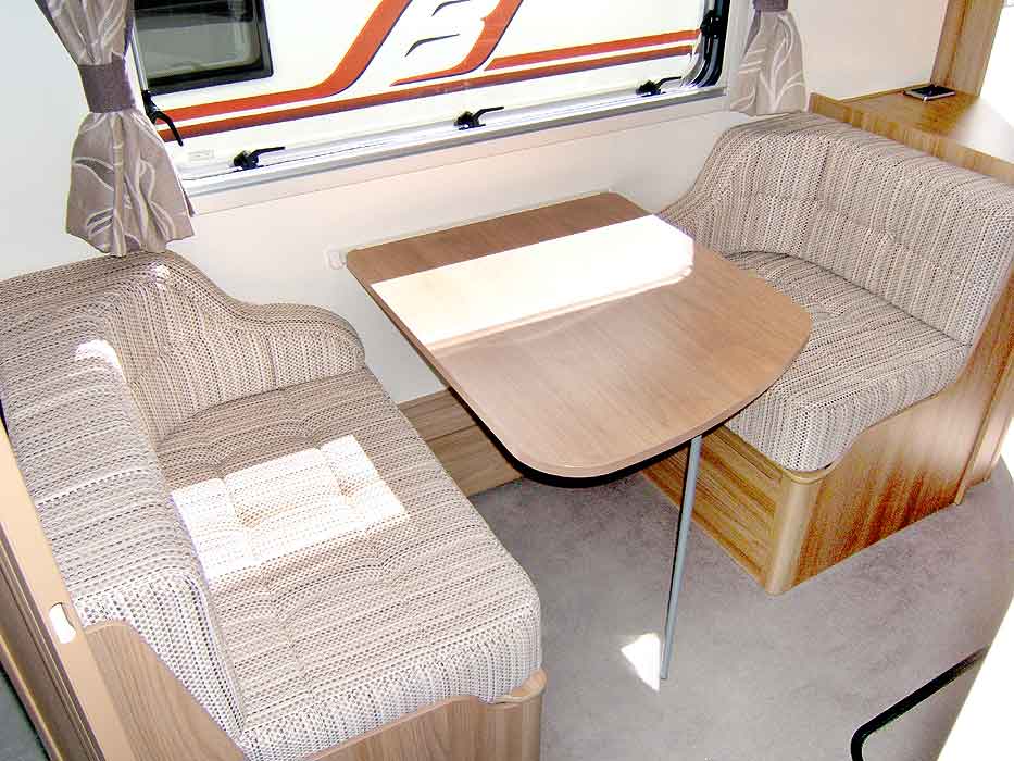 The fixed Dinette area conveniently located within the caravan for access from the kitchen.